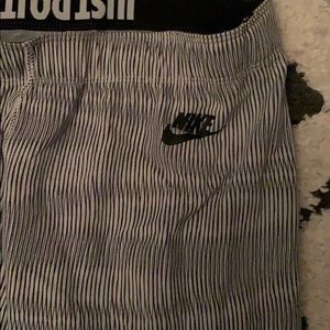 Nike medium leggings, black and white stripes.